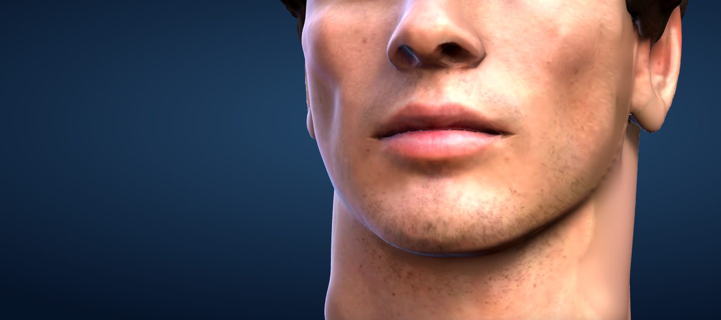 The cover face’s jaw, chin and lips, lit from the right